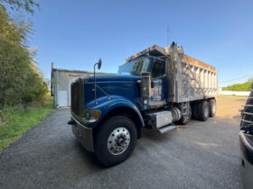 2006 INTERNATIONAL PAYSTAR 5000 TRI-AXLE DUMP W/188K MILES ON CERTIFIED CAT OVERHAUL